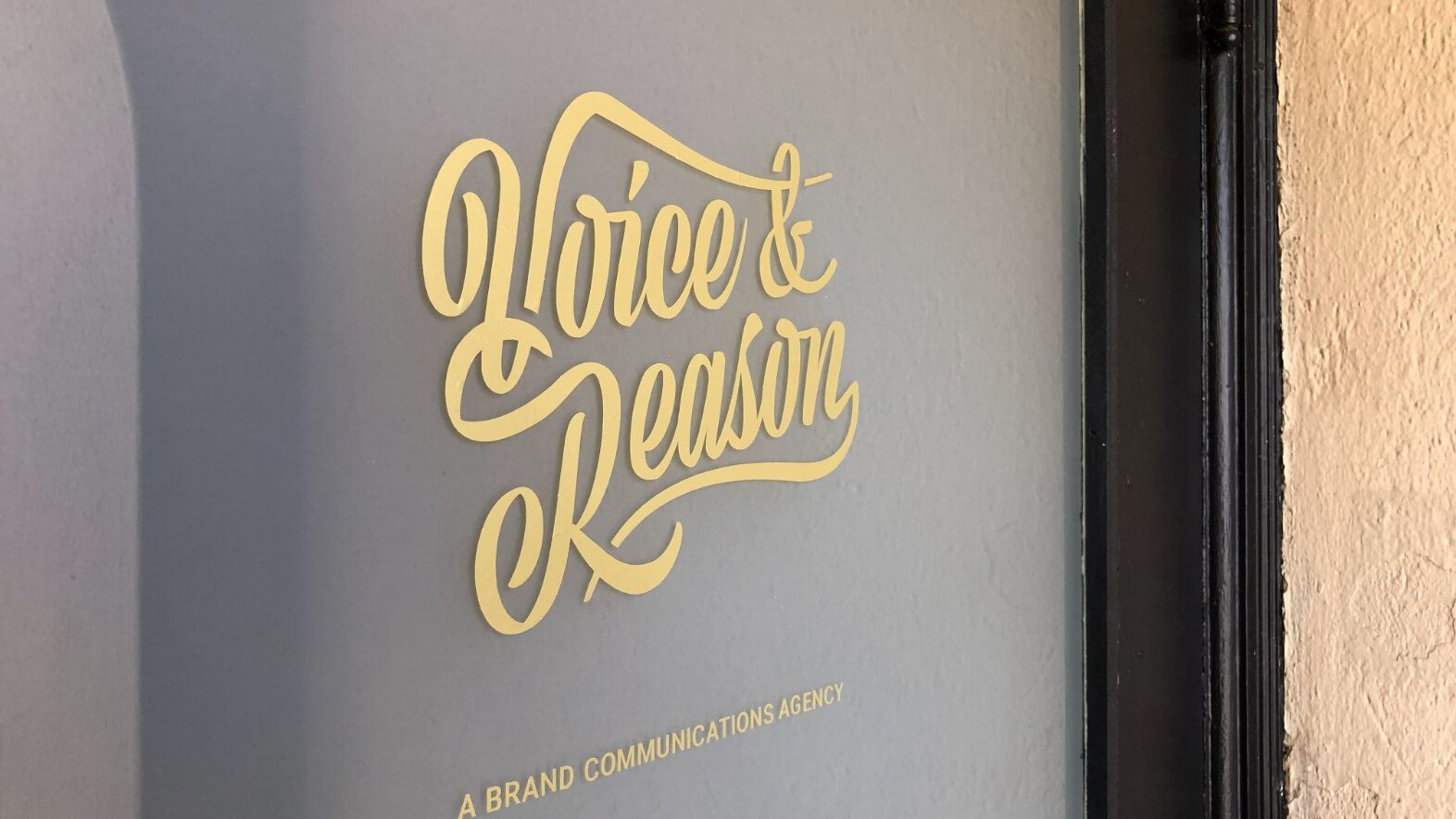 Voice & Reason logo on door